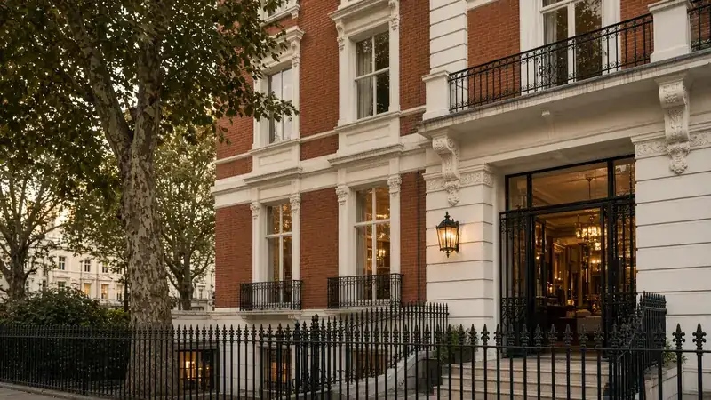Illustration of a Kensington hotel facade with iron railings
